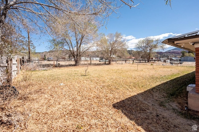 63 E Main, Bicknell, UT 84715 - view of yard featuring a mountain view and fence