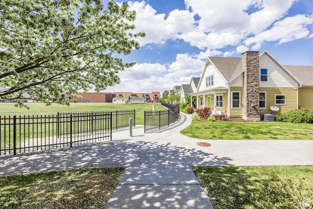 exterior space with a lawn and fence