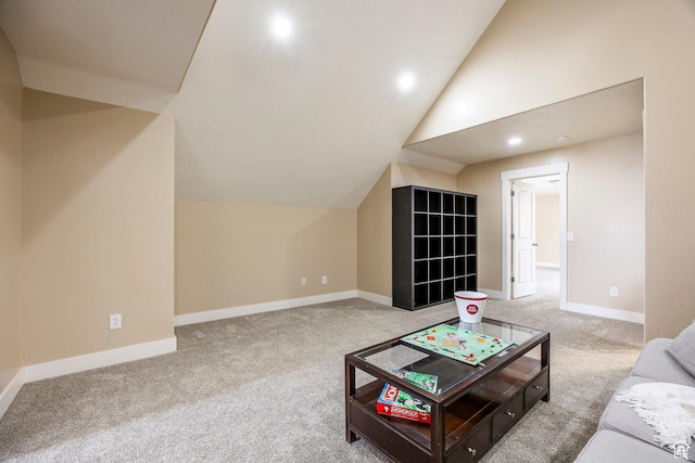 carpeted living room featuring baseboards, vaulted ceiling, and recessed lighting