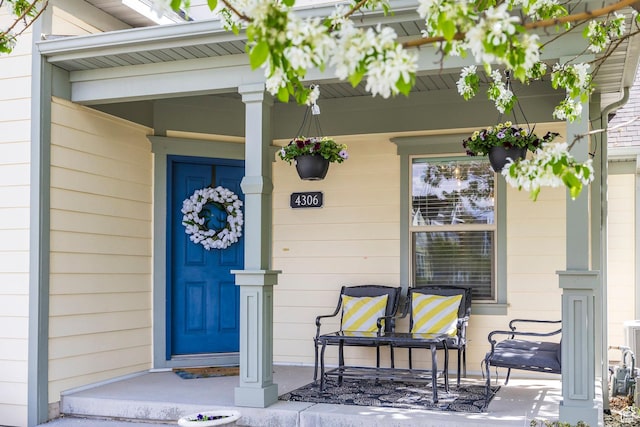 doorway to property featuring a porch