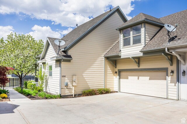 4306 Degray Dr, South Jordan, UT 84095 - view of home's exterior with concrete driveway and a shingled roof