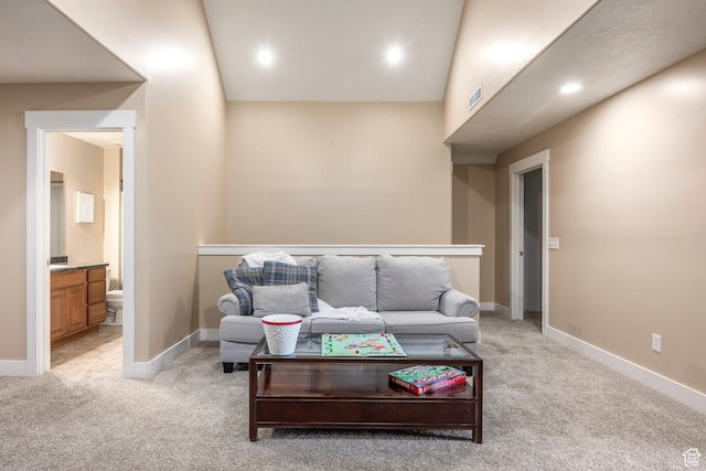 living area with visible vents, recessed lighting, baseboards, and light carpet