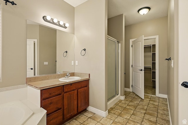194 S 2875 W, Cedar City, UT 84720 - bathroom with vanity, a shower stall, a garden tub, and a spacious closet