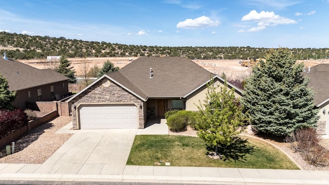 194 S 2875 W, Cedar City, UT 84720 - ranch-style house featuring a garage, a front lawn, fence, stone siding, and driveway