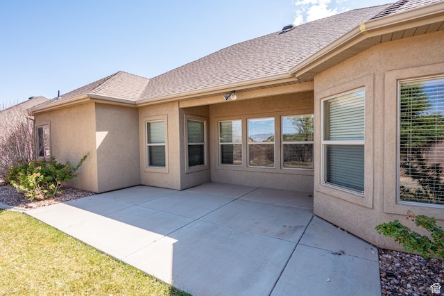 194 S 2875 W, Cedar City, UT 84720 - rear view of house featuring a patio area, roof with shingles, and stucco siding