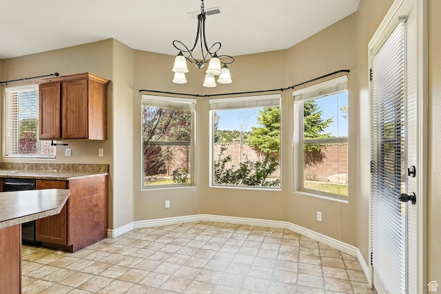 194 S 2875 W, Cedar City, UT 84720 - unfurnished dining area with plenty of natural light, stone tile floors, and visible vents