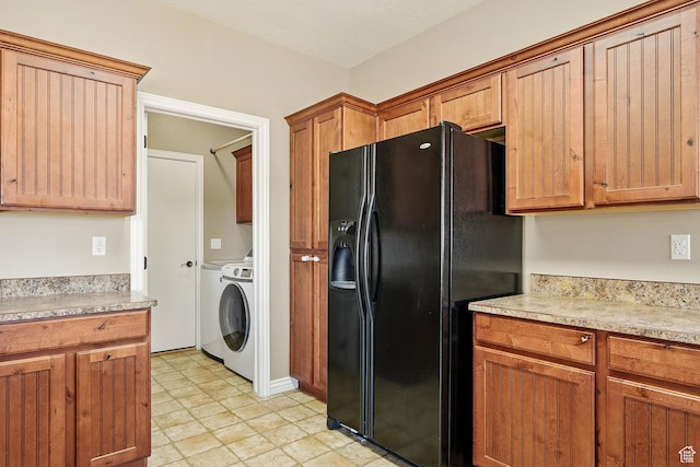 194 S 2875 W, Cedar City, UT 84720 - kitchen featuring light countertops, separate washer and dryer, brown cabinets, and black refrigerator with ice dispenser