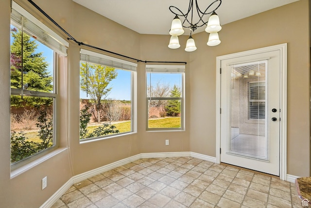 194 S 2875 W, Cedar City, UT 84720 - unfurnished dining area with baseboards, a notable chandelier, and stone finish floor