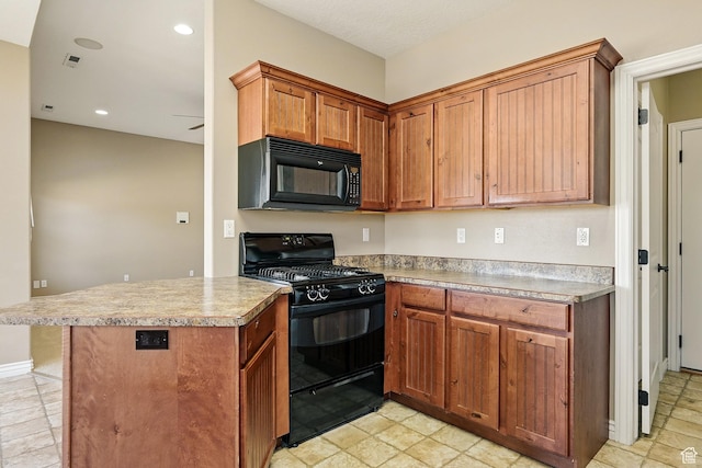 194 S 2875 W, Cedar City, UT 84720 - kitchen with brown cabinetry, light countertops, a peninsula, and black appliances