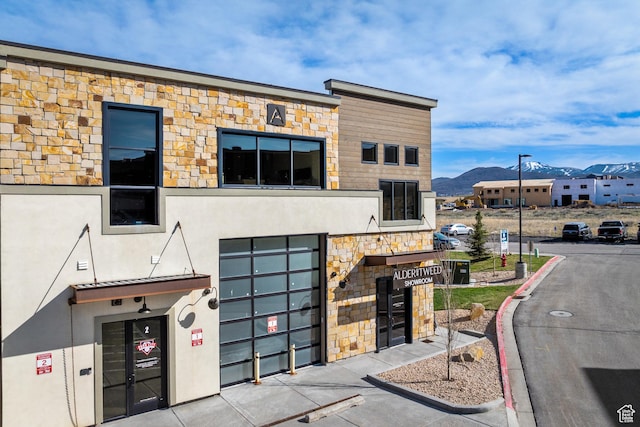 4554 N Forestdale Dr Unit A1, Park City, UT 84098 - contemporary home featuring a mountain view, stucco siding, and stone siding