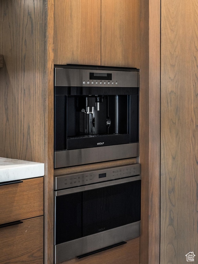 4554 N Forestdale Dr Unit A1, Park City, UT 84098 - details featuring modern cabinets, brown cabinetry, and oven