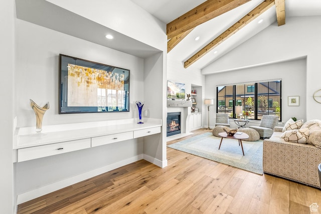 522 N Farmhouse Way, Midway, UT 84049 - living area featuring a fireplace with flush hearth, beam ceiling, high vaulted ceiling, light wood finished floors, and recessed lighting