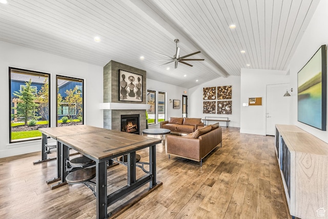 522 N Farmhouse Way, Midway, UT 84049 - living room with a ceiling fan, a tiled fireplace, wooden ceiling, light wood-style floors, and vaulted ceiling with beams