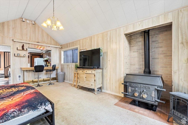 2405 Success Trl Unit 30, Midway, UT 84049 - carpeted bedroom with wooden walls, a wood stove, a chandelier, freestanding refrigerator, and vaulted ceiling