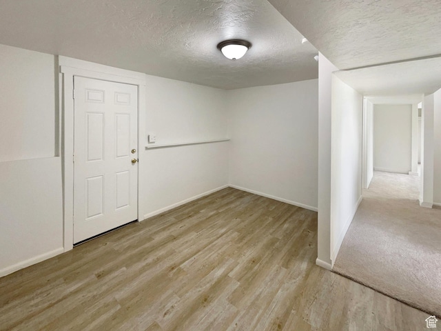 722 E 1300 N, Ogden, UT 84404 - spare room featuring baseboards, a textured ceiling, and wood finished floors