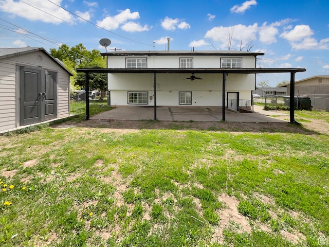 722 E 1300 N, Ogden, UT 84404 - back of property with ceiling fan, a storage shed, a patio area, fence, and a yard