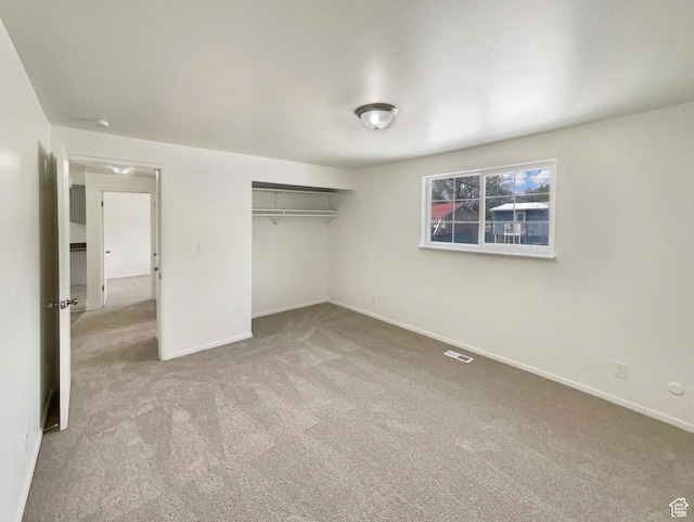 722 E 1300 N, Ogden, UT 84404 - unfurnished bedroom with visible vents, carpet, baseboards, and a closet