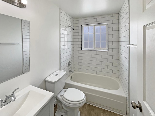 722 E 1300 N, Ogden, UT 84404 - bathroom featuring vanity, shower / bathtub combination, wood finished floors, and toilet