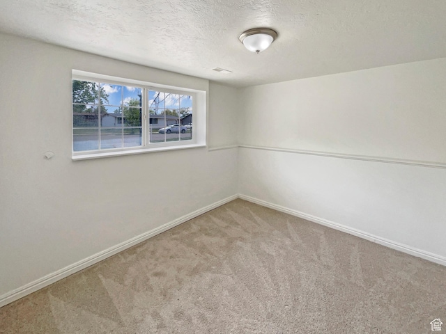 722 E 1300 N, Ogden, UT 84404 - carpeted empty room featuring a textured ceiling and baseboards