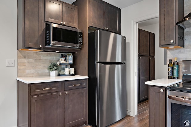 3841 E Grindstone Dr S, Springville, UT 84663 - kitchen with light countertops, dark brown cabinetry, appliances with stainless steel finishes, and dark wood-type flooring