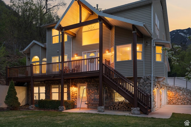 3841 E Grindstone Dr S, Springville, UT 84663 - rear view of property featuring stairs, a wooden deck, a yard, and stone siding