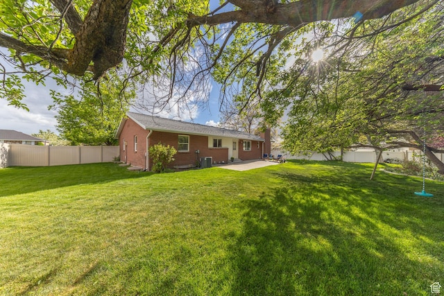 1145 Creek View Dr, Fruit Heights, UT 84037 - rear view of house with central air condition unit, a patio area, and brick siding