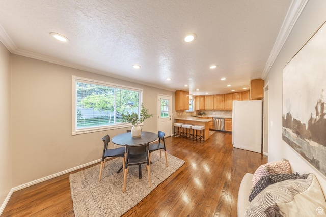 1145 Creek View Dr, Fruit Heights, UT 84037 - dining area with crown molding, recessed lighting, wood finished floors, baseboards, and a textured ceiling