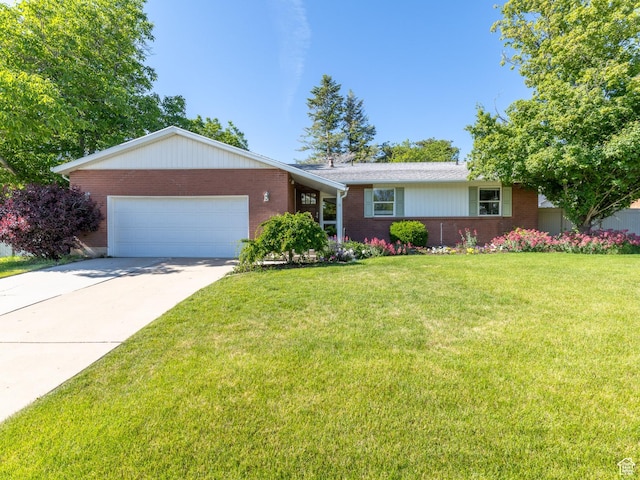 1145 Creek View Dr, Fruit Heights, UT 84037 - ranch-style home featuring brick siding, a garage, a front yard, and driveway