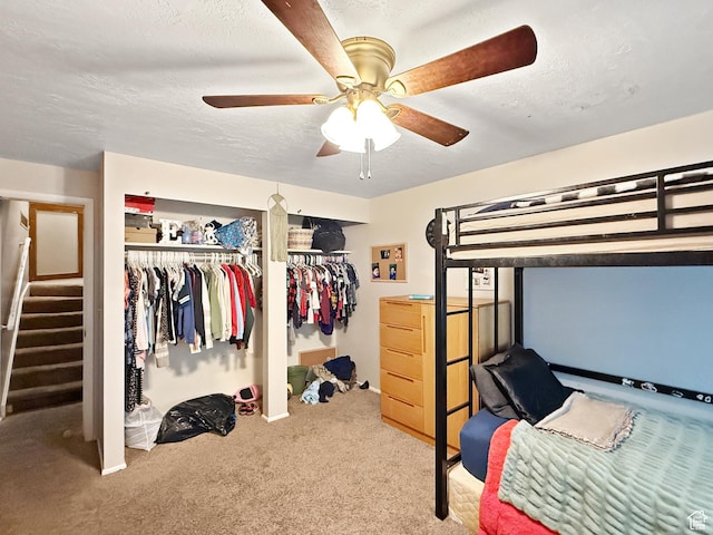 1357 S Lorl Ln # 2, Ogden, UT 84404 - carpeted bedroom featuring a closet, a textured ceiling, and ceiling fan