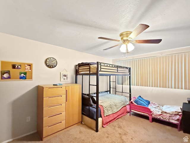 1357 S Lorl Ln # 2, Ogden, UT 84404 - bedroom featuring light colored carpet, a ceiling fan, and a textured ceiling