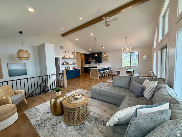 2774 S Chukar Dr, Garden City, UT 84028 - living room featuring light wood-type flooring, beam ceiling, high vaulted ceiling, ceiling fan with notable chandelier, and recessed lighting