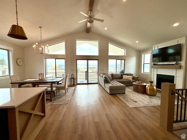 2774 S Chukar Dr, Garden City, UT 84028 - living room with a wealth of natural light, light wood finished floors, and a fireplace