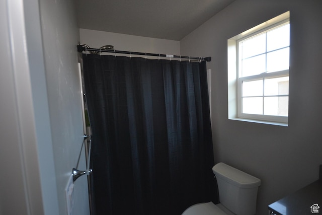 5745 N Gray Hawk Dr, Stansbury Park, UT 84074 - bathroom with toilet and a shower with curtain