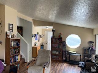 2622 N 175 W, Sunset, UT 84015 - living area with a textured ceiling, stairway, and wood finished floors
