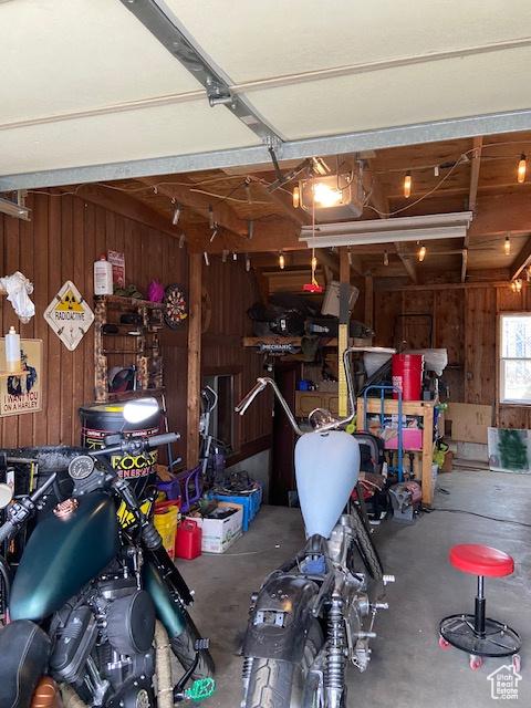 2622 N 175 W, Sunset, UT 84015 - garage featuring wood walls and a garage door opener