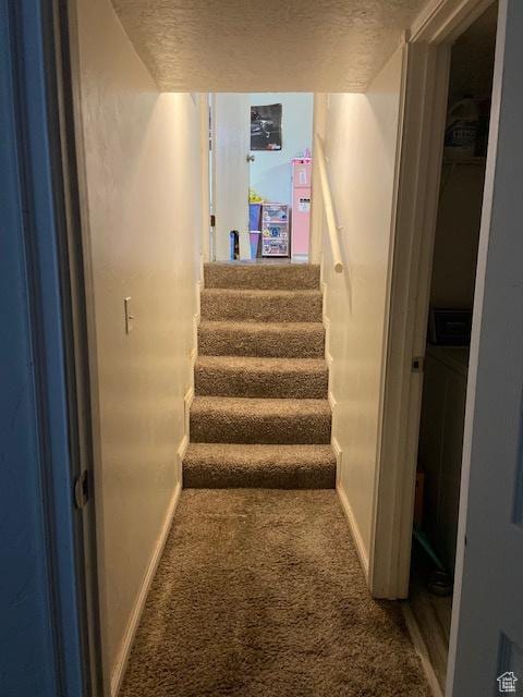 2622 N 175 W, Sunset, UT 84015 - stairway with carpet floors, baseboards, and a textured ceiling