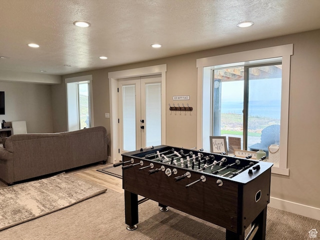 660 N Cambry Dr, Garden City, UT 84028 - recreation room with french doors, recessed lighting, and a textured ceiling