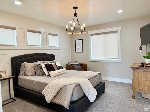 660 N Cambry Dr, Garden City, UT 84028 - carpeted bedroom featuring baseboards, multiple windows, recessed lighting, and a notable chandelier