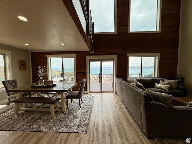 660 N Cambry Dr, Garden City, UT 84028 - dining space with recessed lighting, wood walls, plenty of natural light, and light wood-type flooring