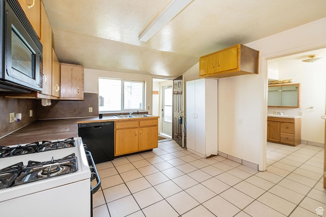 3122 W 1975 N, Plain City, UT 84404 - kitchen with a sink, light tile patterned floors, black appliances, and lofted ceiling