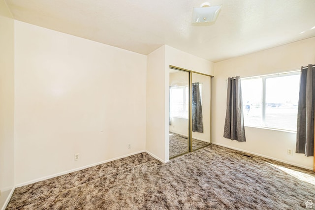 3122 W 1975 N, Plain City, UT 84404 - unfurnished bedroom featuring carpet flooring, baseboards, and a closet