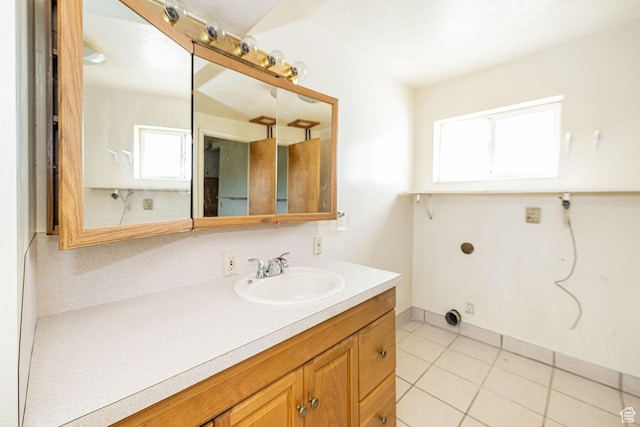 3122 W 1975 N, Plain City, UT 84404 - bathroom with a healthy amount of sunlight, vanity, and tile patterned flooring