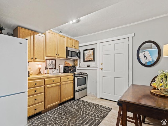 1417 E Binford St, Ogden, UT 84401 - kitchen featuring light countertops, stainless steel appliances, and a sink