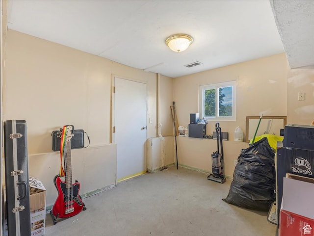 misc room featuring visible vents and unfinished concrete flooring