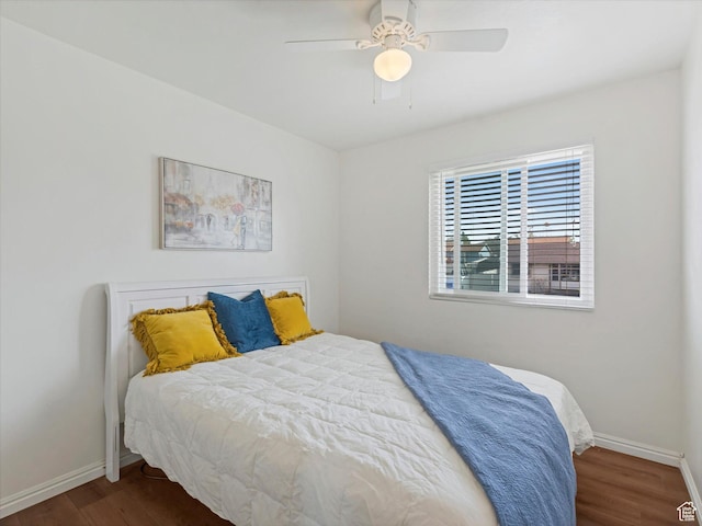bedroom with baseboards, a ceiling fan, and wood finished floors