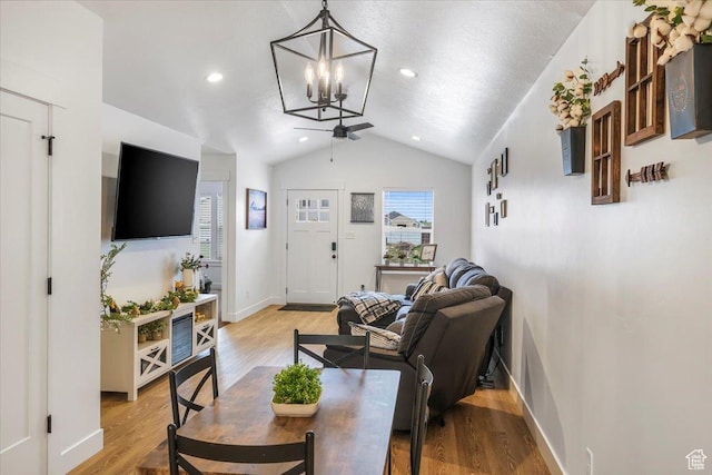 591 S Lakeside Dr, Franklin, ID 83237 - living area with light wood finished floors, ceiling fan with notable chandelier, recessed lighting, baseboards, and vaulted ceiling