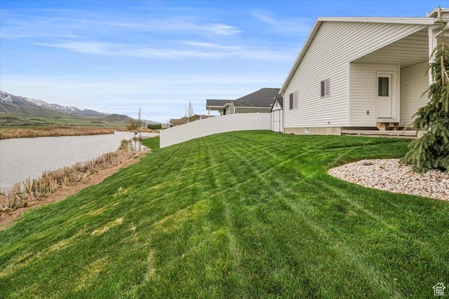 591 S Lakeside Dr, Franklin, ID 83237 - view of yard with fence and a water and mountain view