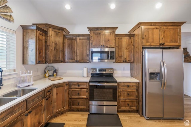 591 S Lakeside Dr, Franklin, ID 83237 - kitchen featuring light countertops, stainless steel appliances, a sink, and light wood finished floors