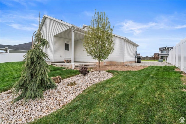 591 S Lakeside Dr, Franklin, ID 83237 - view of side of home featuring a lawn and fence