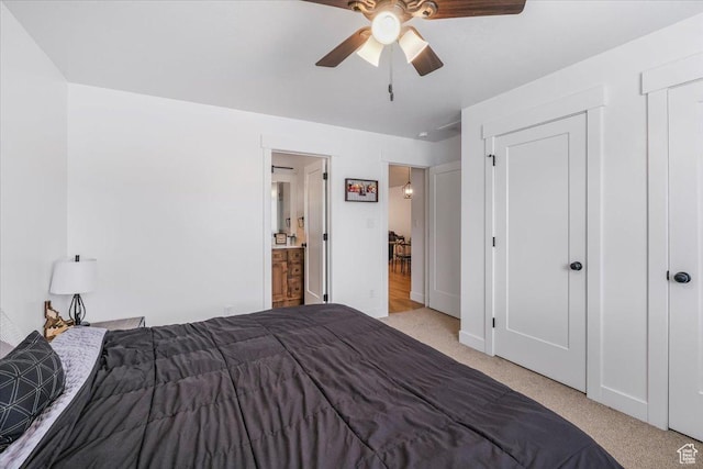 591 S Lakeside Dr, Franklin, ID 83237 - carpeted bedroom featuring a ceiling fan and connected bathroom